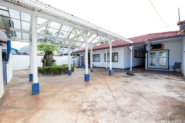 view of car parking featuring french doors