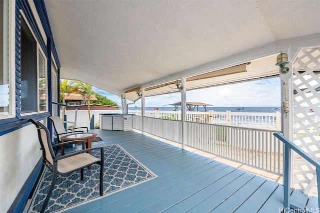 wooden deck with a water view