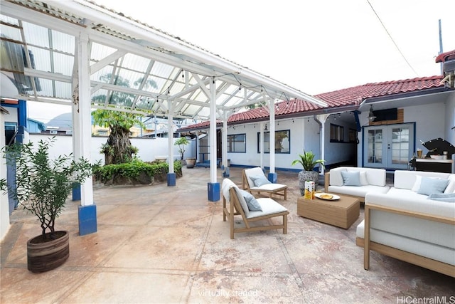 view of patio with french doors and outdoor lounge area