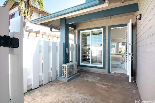 view of exterior entry featuring ac unit