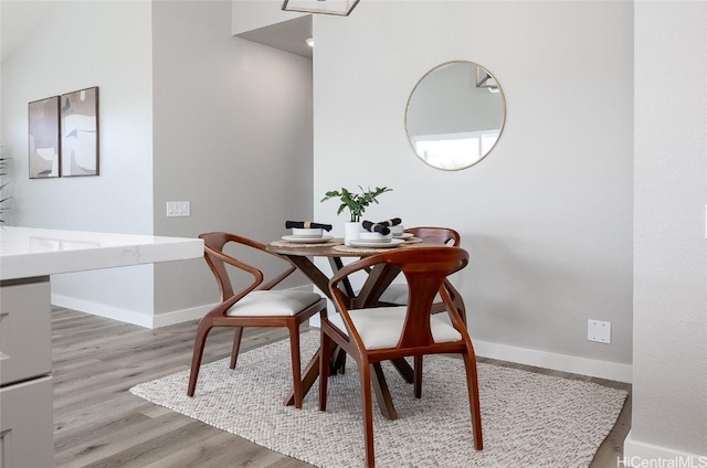 dining space with light wood-type flooring