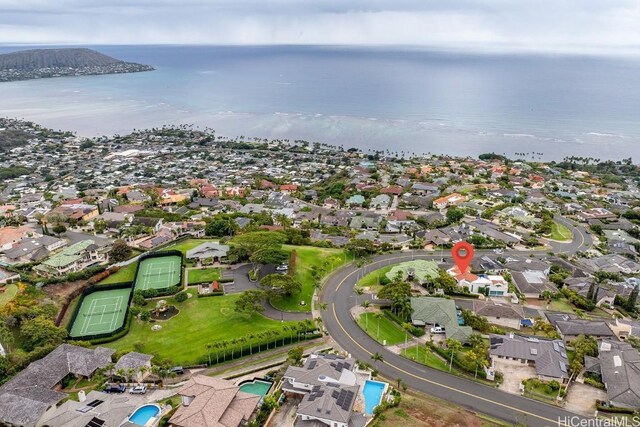 birds eye view of property featuring a water view