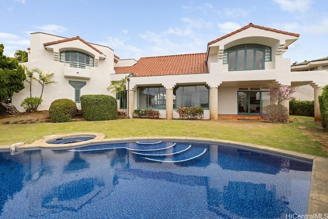 rear view of house with a lawn