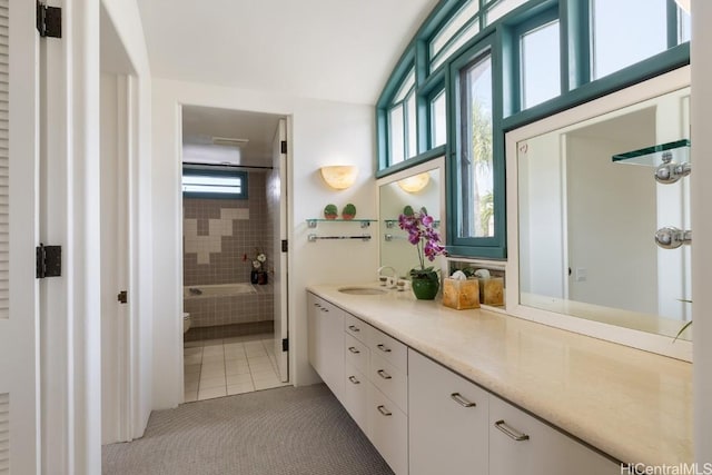 bathroom featuring tile patterned flooring and vanity