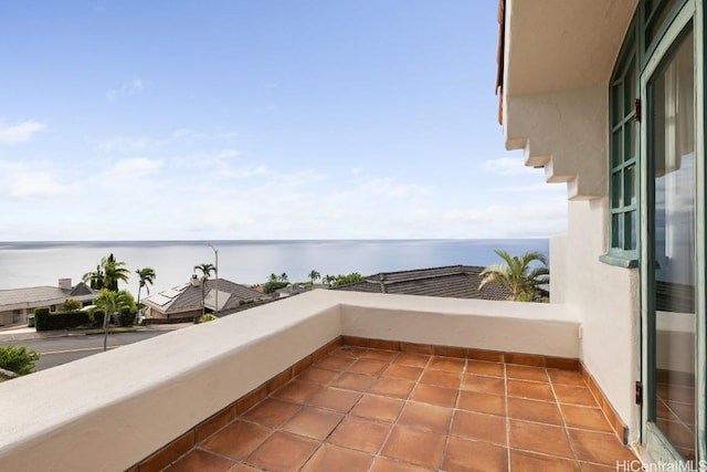 balcony featuring a water view