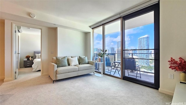 carpeted living room featuring floor to ceiling windows