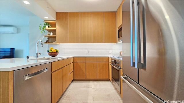 kitchen with appliances with stainless steel finishes, kitchen peninsula, sink, and decorative backsplash