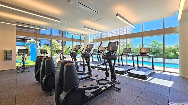 gym with a wealth of natural light and floor to ceiling windows