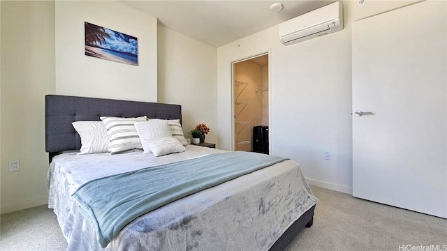 bedroom featuring light carpet and a wall unit AC