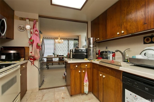 kitchen with electric stove, sink, dishwasher, decorative light fixtures, and a chandelier