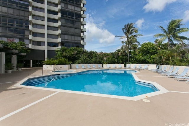 view of swimming pool featuring a patio area