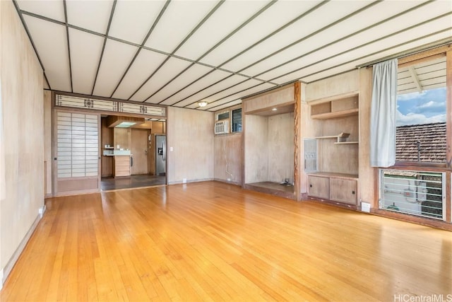 unfurnished living room featuring light hardwood / wood-style floors