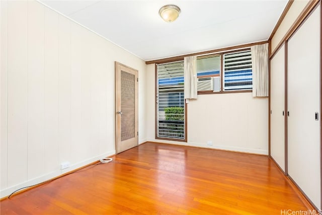 unfurnished bedroom featuring hardwood / wood-style flooring