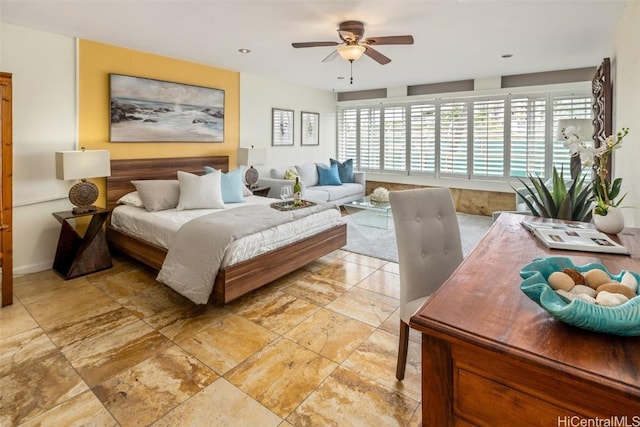 bedroom with multiple windows and a ceiling fan