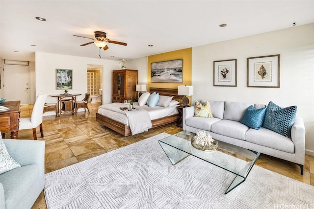 living area with ceiling fan and recessed lighting