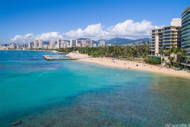 water view featuring a view of city and a beach view