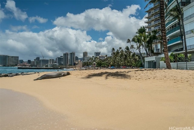 exterior space with a city view and a water view