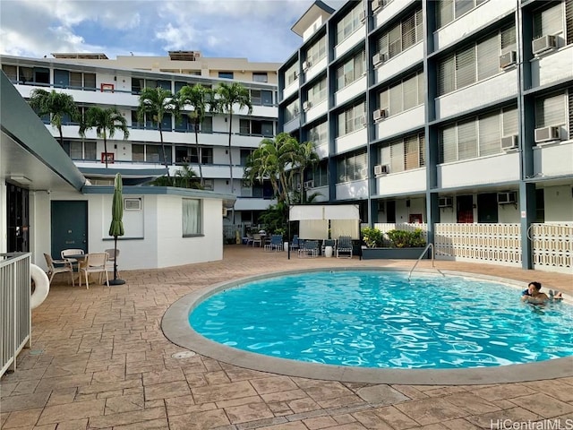 view of pool featuring cooling unit