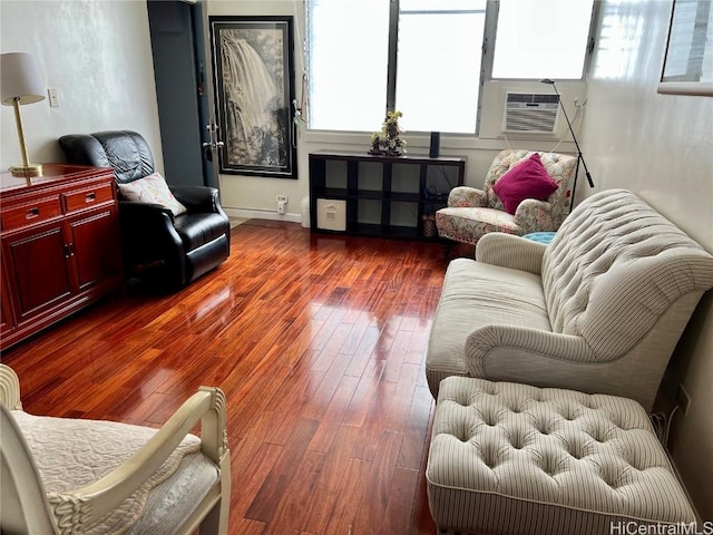 living room featuring cooling unit and dark hardwood / wood-style floors