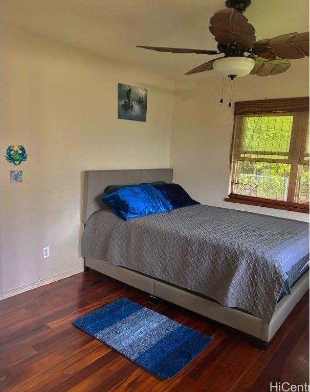 bedroom featuring dark wood-type flooring and ceiling fan