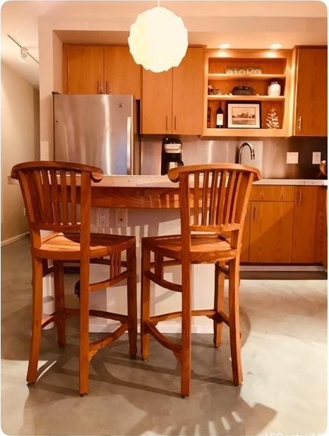 interior space with sink, track lighting, and stainless steel refrigerator