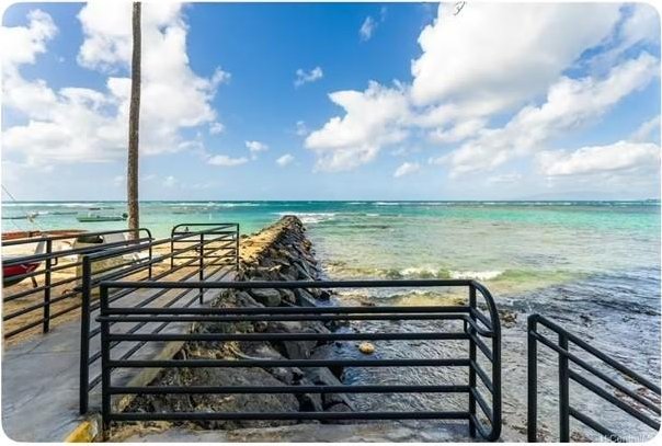 water view featuring an exterior structure and a beach view