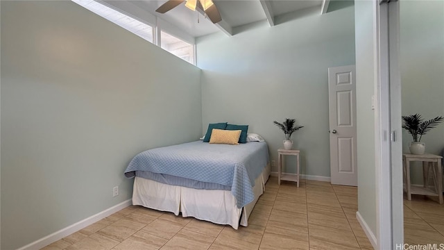 tiled bedroom featuring ceiling fan and beam ceiling