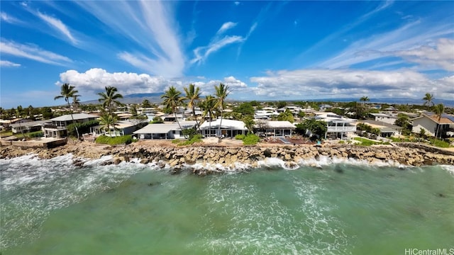 drone / aerial view featuring a view of the beach and a water view