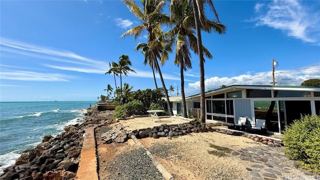 exterior space featuring a beach view