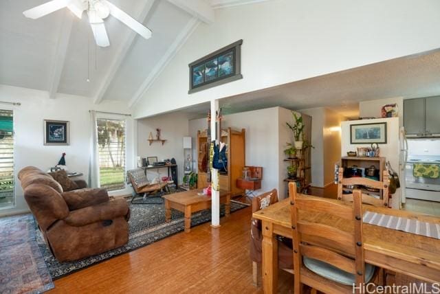 interior space featuring beamed ceiling, ceiling fan, hardwood / wood-style flooring, and high vaulted ceiling