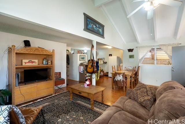 living room featuring hardwood / wood-style floors, high vaulted ceiling, beamed ceiling, and ceiling fan