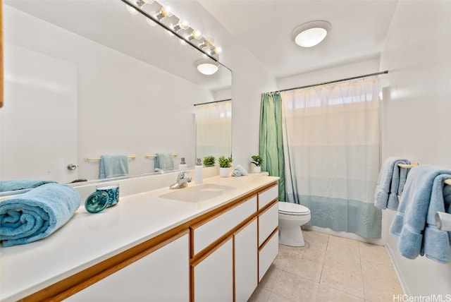 full bathroom featuring tile patterned flooring, vanity, toilet, and shower / bathtub combination with curtain