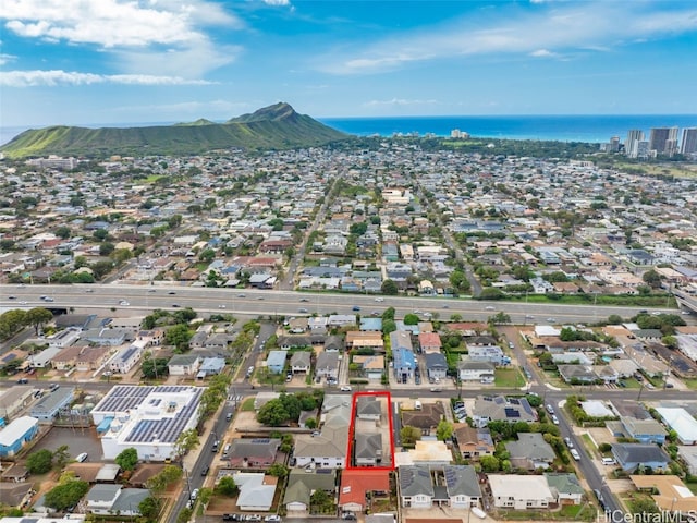 birds eye view of property featuring a water and mountain view