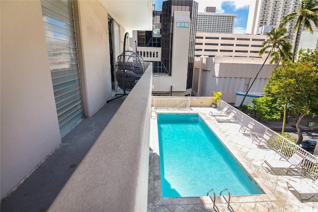 view of swimming pool featuring a patio area