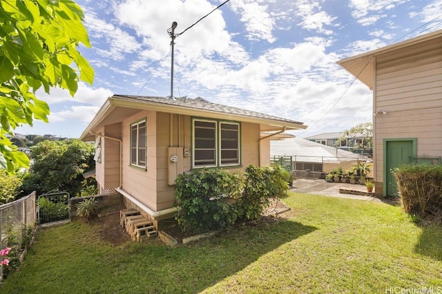 view of outbuilding with fence