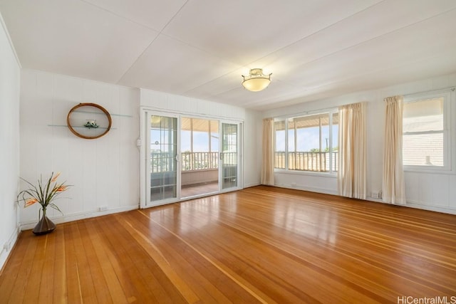 empty room with hardwood / wood-style floors