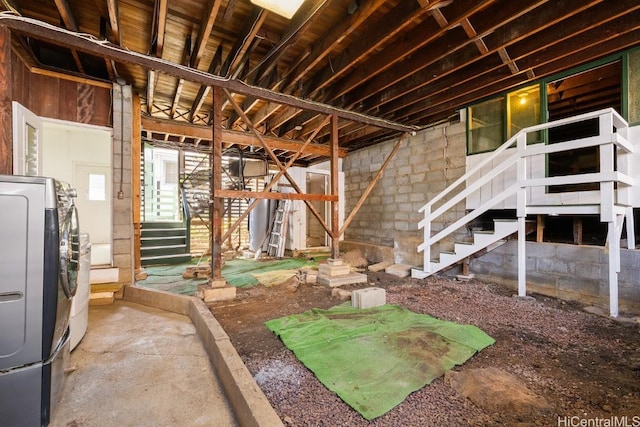 interior space featuring washer / clothes dryer and stairway