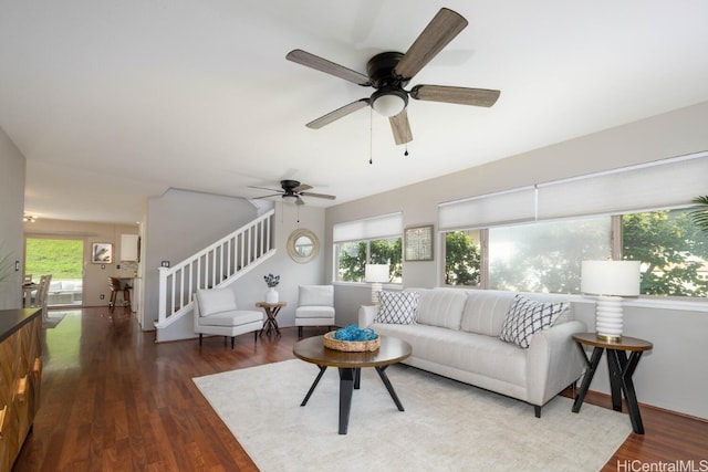 living room featuring dark hardwood / wood-style floors and a healthy amount of sunlight