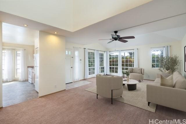 living room featuring light carpet, vaulted ceiling, and ceiling fan