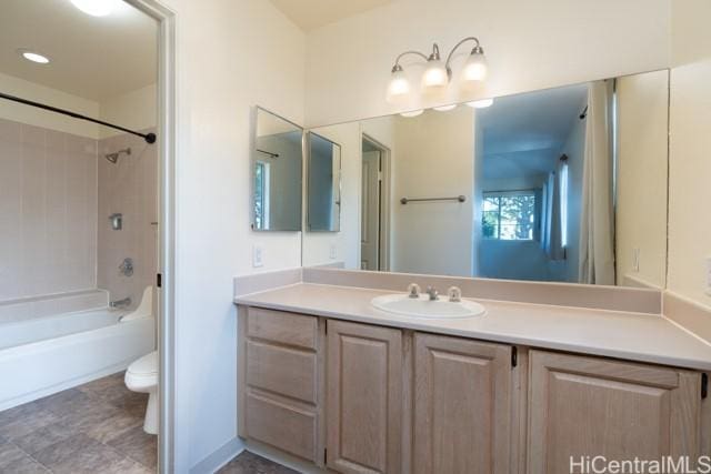 full bathroom with vanity, bathtub / shower combination, and toilet