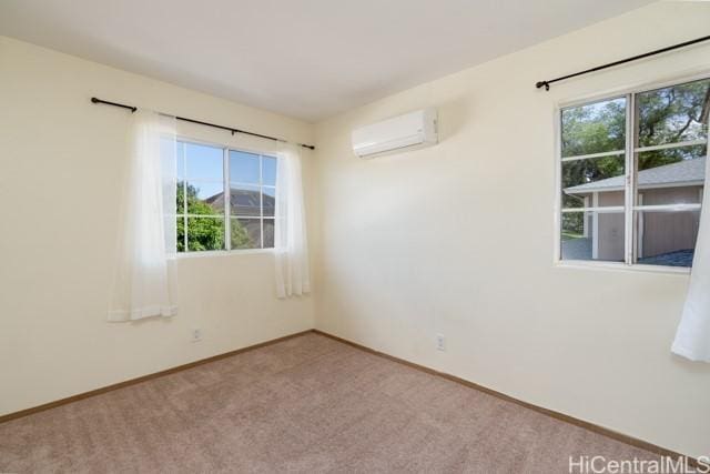 carpeted empty room featuring a wall unit AC