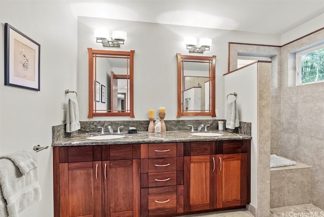 bathroom featuring vanity and a tile shower