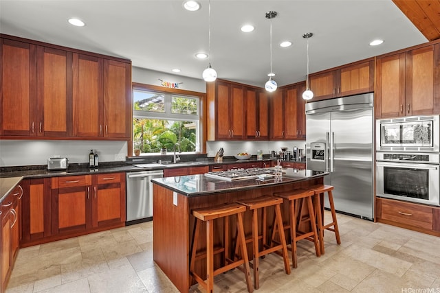 314 Lapa Pl, Kailua, HI 96734 - kitchen featuring built in appliances, a kitchen island, pendant lighting, recessed lighting, and a kitchen breakfast bar