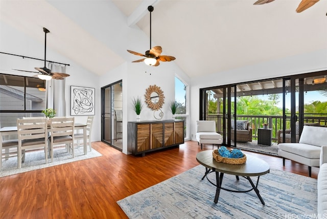 living room featuring ceiling fan, beamed ceiling, high vaulted ceiling, and wood finished floors