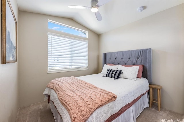 bedroom featuring carpet floors, vaulted ceiling, and ceiling fan