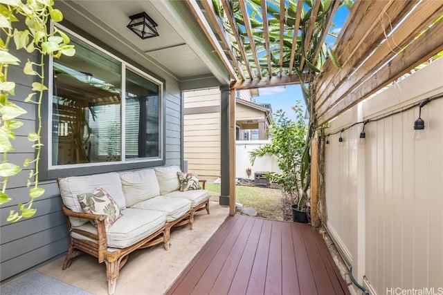 wooden terrace with outdoor lounge area, a pergola, and a patio