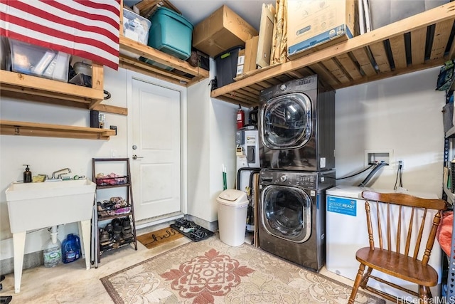 laundry area with stacked washer / dryer