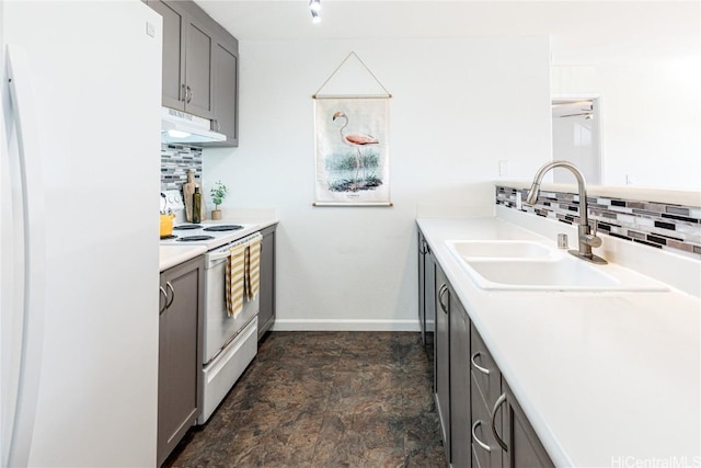 kitchen with sink, white appliances, gray cabinets, and backsplash