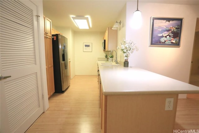 hall with sink and light hardwood / wood-style floors