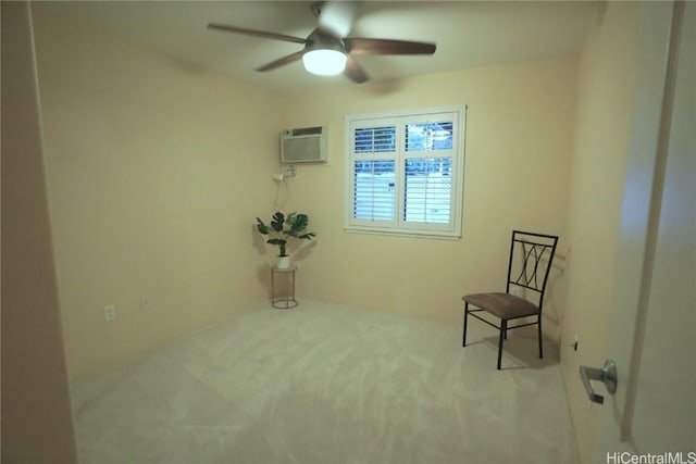 unfurnished room featuring ceiling fan, light colored carpet, and a wall mounted air conditioner